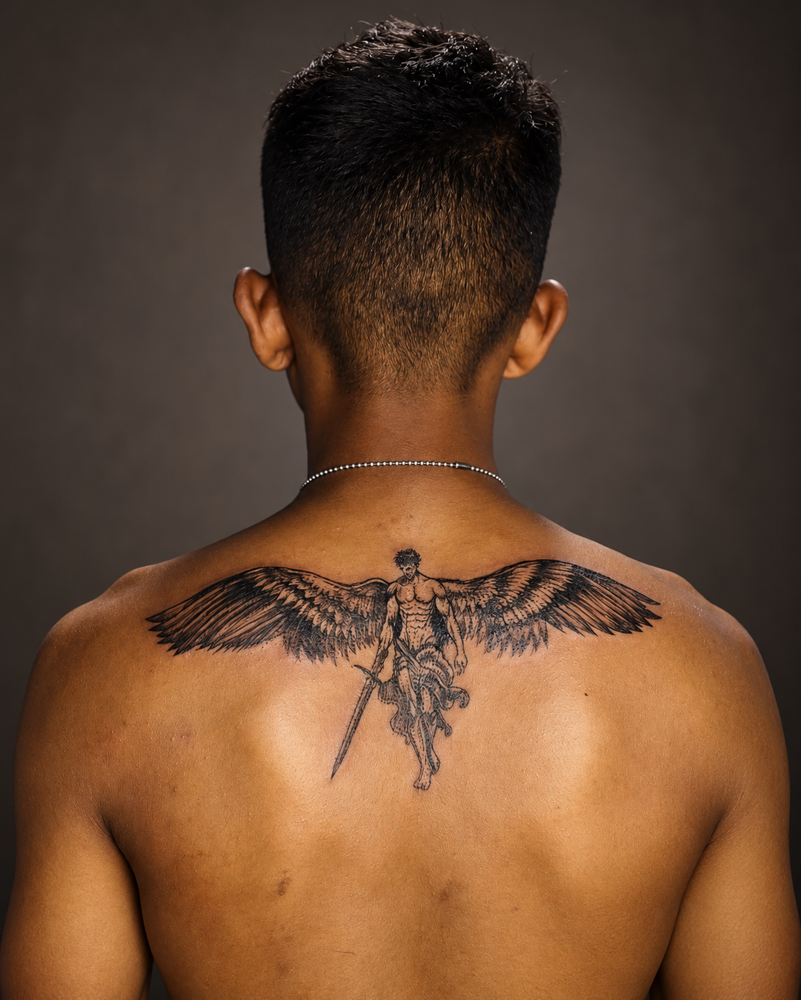 Winged warrior back tattoo